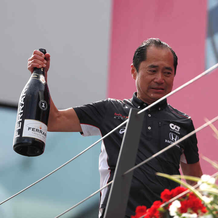 Toyoharu Tanabe holding bottle of champagne