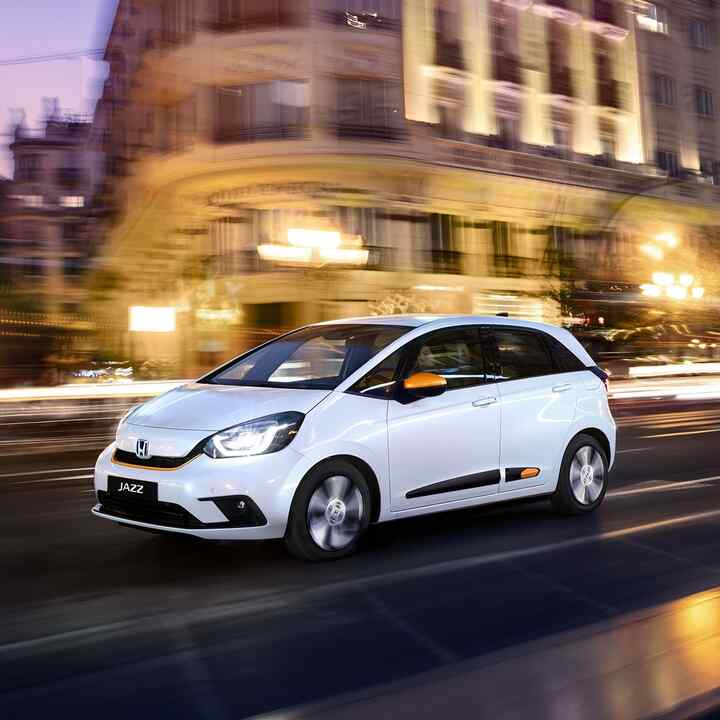 Front Facing Three Quarter Honda Jazz Hybrid driving in the city