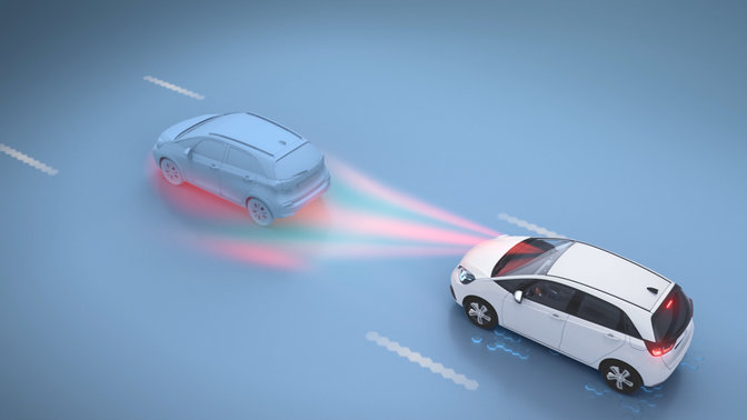 Honda car driving behind another car showing detection signal in Collision management